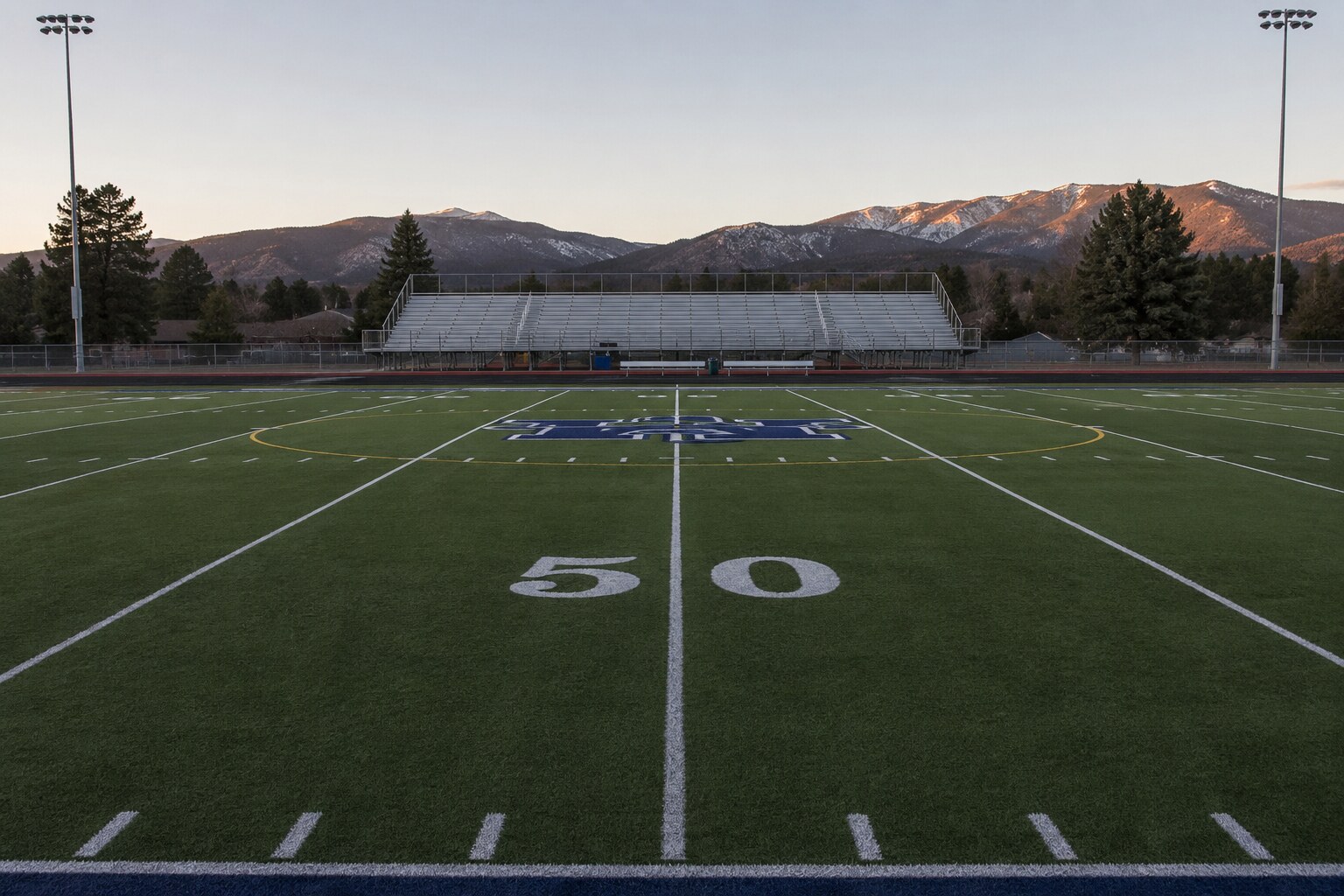 An empty football field at the foot of the mountains in Northern Nevada